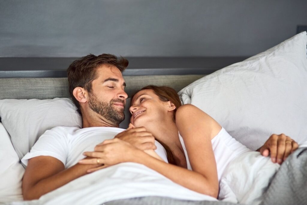 image2 - Embrace 360 Couple discussing sleep preferences on a no squeak bed frame